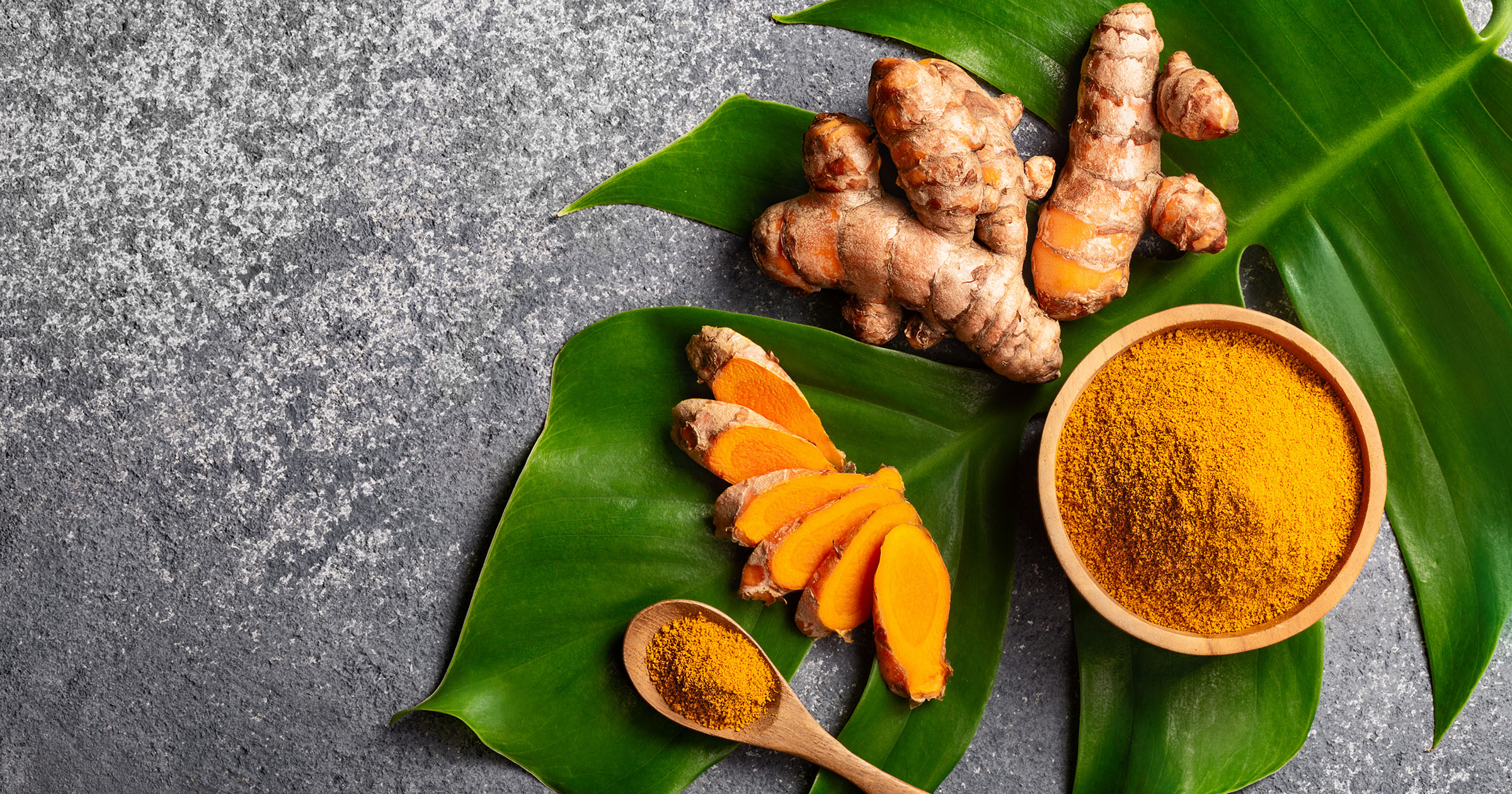 Turmeric health: Turmeric roots and powdered golden spice on display